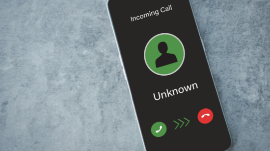 Unknown caller, Scammer or stranger.Scam on phone and online-Shutterstock_2201321777